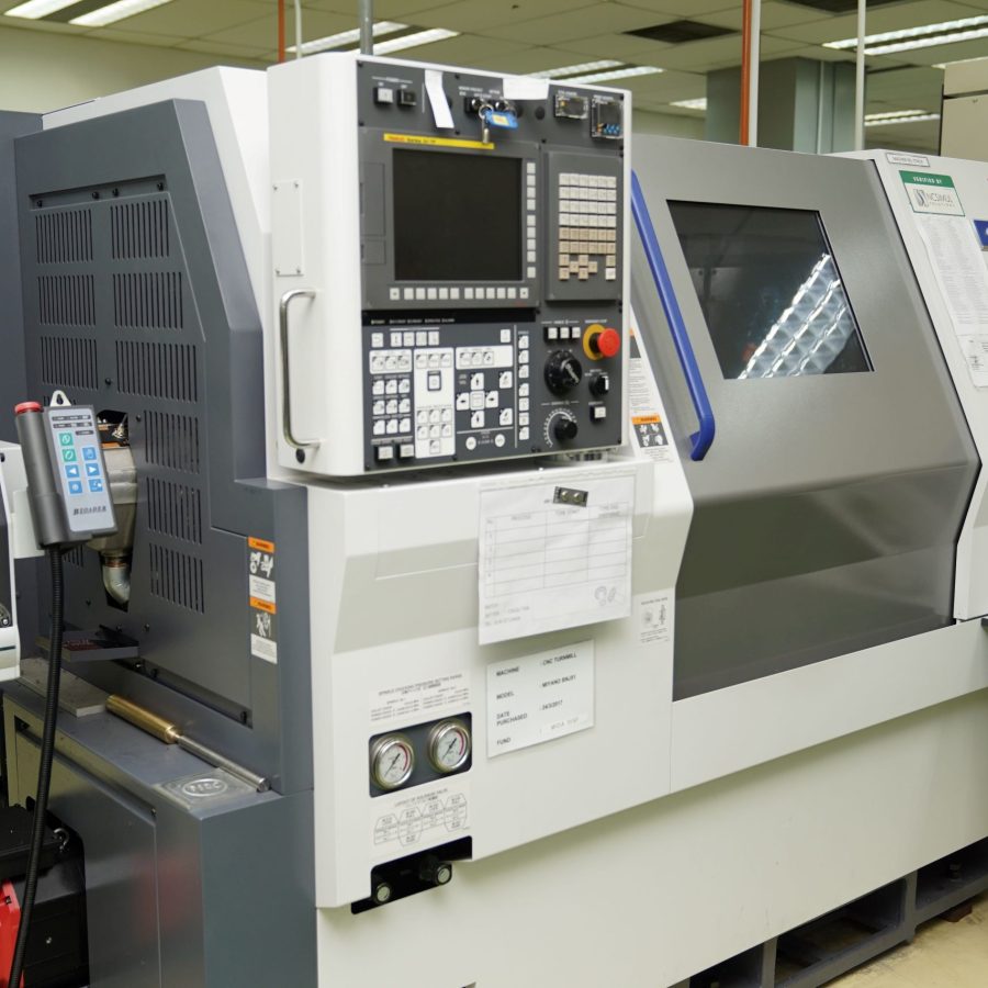 a large CNC machine with control panel